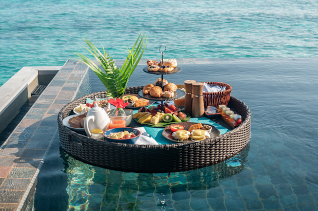 Floating breakfast tray in luxury resort, in a Maldives overwater bungalow