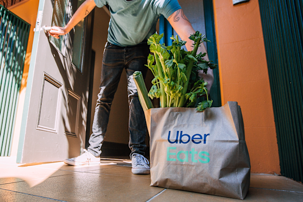 Uber Eats home delivers Woolworths groceries