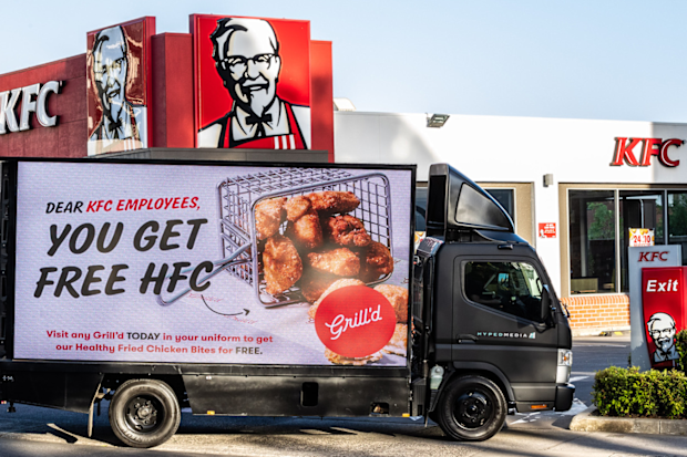 Grill'd billboard outside KFC store