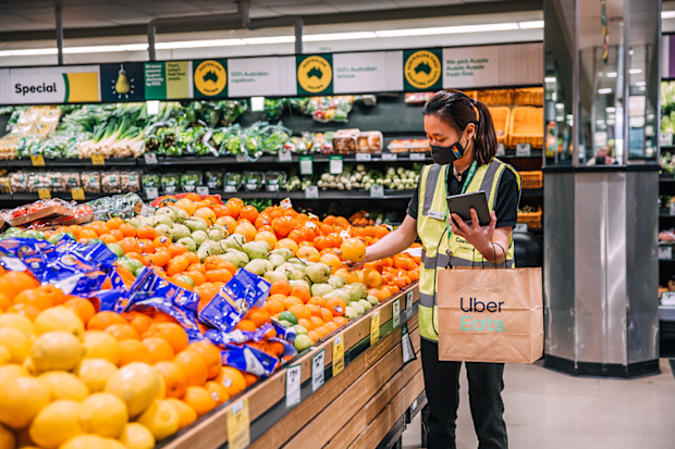 Woolworths personal shoppers collecting groceries for Uber Eats