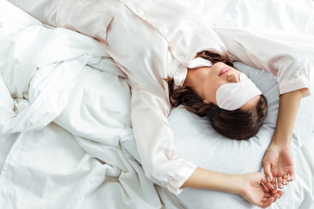 Woman sleeping with sleep mask