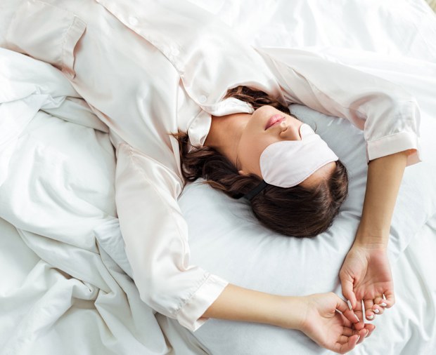 Woman sleeping with sleep mask