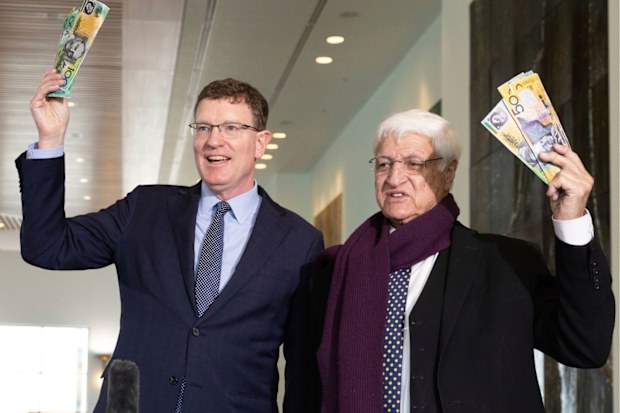Member for Calare, Andrew Gee, and Member for Kennedy, Bob Katter, pose with fake money after addressing the media at a press conference following the introduction of the Keeping Cash Transactions in Australia Bill 2024, at Parliament House in Canberr