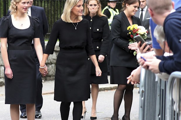 From left, Britain's Prince Edward, Lady Louise Windsor, Sophie Countess of Wessex, Princess Beatrice and Princess Eugenie view floral tributes for Queen Elizabeth II outside the gates of Balmoral Castle in Aberdeenshire, Scotland Saturday, Sept. 10, 2022.  