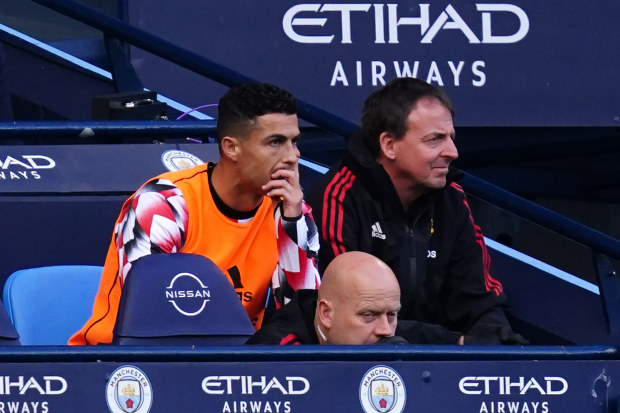 Manchester United's Cristiano Ronaldo reacts on the bench during the Premier League match at the Etihad Stadium.