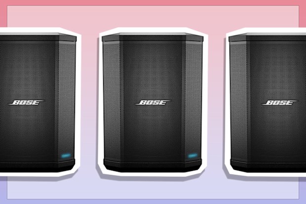 9PR: Bose S1 Pro Portable Bluetooth Speaker System without Battery in Black on pink and purple background.