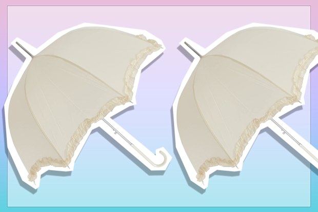 9PR: Women's ivory umbrella with frill trim.