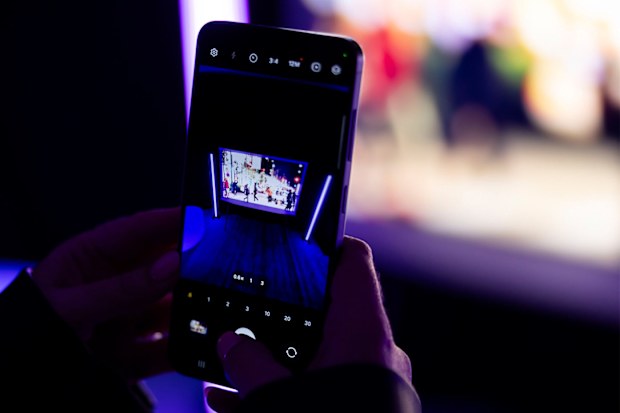 9PR: A person taking a photo using the Nightography setting on the Samsung Galaxy S24