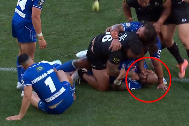 Erin Clark shoves Junior Paulo in the face after bashing over to score.