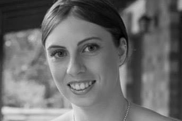 A woman found dead in a Gold Coast backyard with burns to her body has been identified as Kelly Wilkinson.