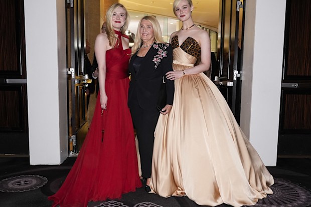 Dakota Fanning, left, and Elle Fanning, right, pose with their grandmother at the 82nd Golden Globes on Sunday, Jan. 5, 2025, at the Beverly Hilton in Beverly Hills, Calif. 