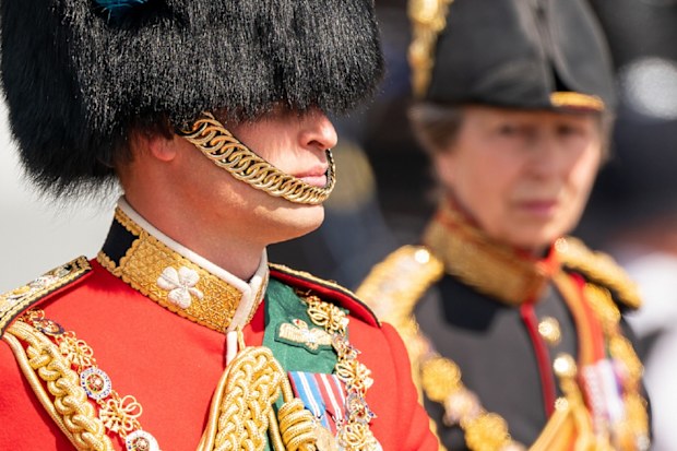 LONDON, ENGLAND - JUNE 02: Prince William (L), Duke of Cambridge, in his role as Colonel of the Irish Guards, and Princess Anne (R), Princess Royal, in her role as Colonel of the Blues and Royals, ride their horses along The Mall during Trooping The Colour on June 2, 2022 in London, England.Trooping The Colour, also known as The Queen's Birthday Parade, is a military ceremony performed by regiments of the British Army that has taken place since the mid-17th century. It marks the official birthda