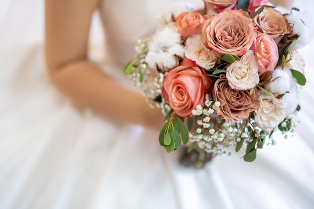 Bride holding flowers