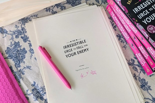 A signed copy of Brigitte Knightley's book, The Irresistible Urge to Fall for Your Enemy.
