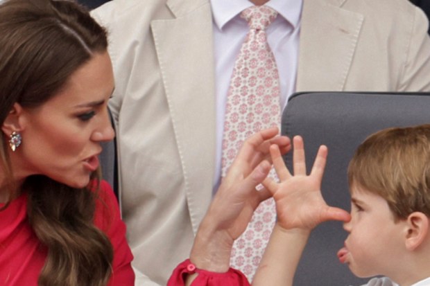 Kate, Duchess of Cambridge, left speaks with Prince Louis, during the Platinum Jubilee Pageant, in London, Sunday June 5, 2022, on the last of four days of celebrations to mark the Platinum Jubilee. The pageant will be a carnival procession up The Mall featuring giant puppets and celebrities that will depict key moments from Queen Elizabeth IIs seven decades on the throne.  (Chris Jackson/Pool Photo via AP)