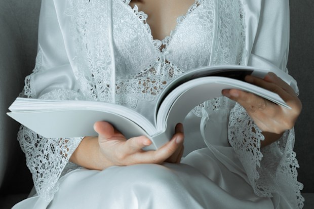 Woman reading journal.