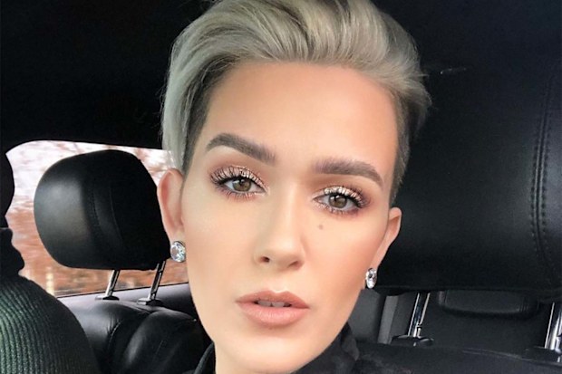 Beauty YouTuber Mel Thompson sitting in a car looking into the camera, taking a selfie.