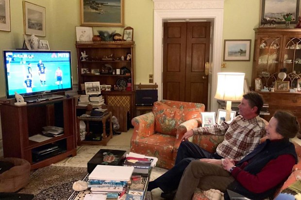 Princess Anne watches rugby in her lounge room.
