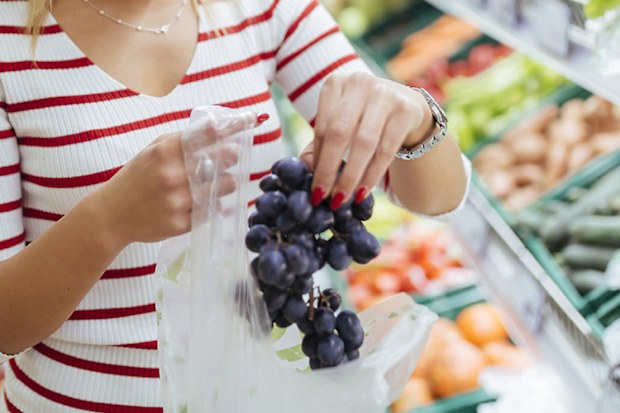 Aldi worker customers eating grapes