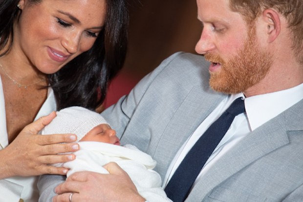 The Duke and Duchess of Sussex with their baby son, who was born on Monday morning, during a photocall in St George's Hall at Windsor Castle.