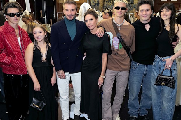 The Beckham family: Cruz Beckham, Harper Beckham, David Beckham, Victoria Beckham, Romeo Beckham,  Brooklyn Beckham and Nicola Peltz Beckham at the Victoria Beckham Spring/summer 2023 Runway show on September 30, 2022 in Paris, France. 