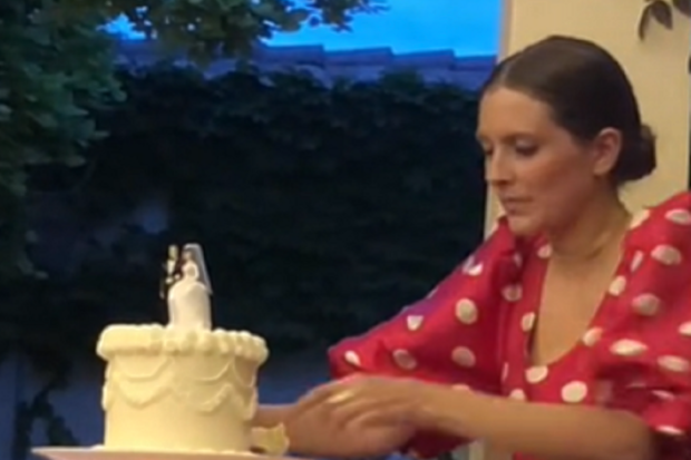 wedding cake eaten by guest before formal slicing