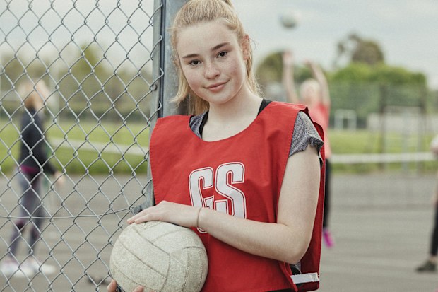 Netballer standing by the court