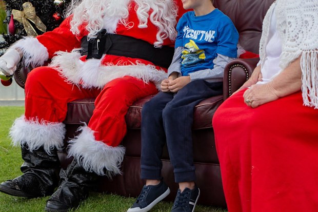 Santa and Mrs Claus meet child