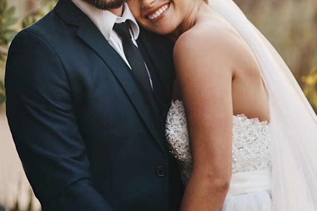 Shot of a happy young couple standing together on their wedding day