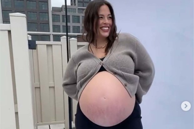 Model Ashley Graham showing off her pregnant belly with twins