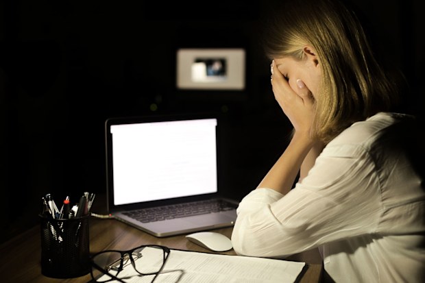 woman upset because of cyberbullying