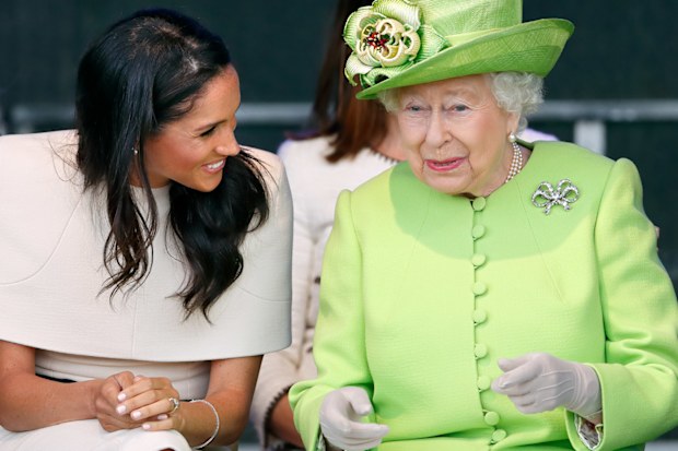 Meghan, Duchess of Sussex and Queen Elizabeth II in Cheshire on their first joint royal engagement in 2018.