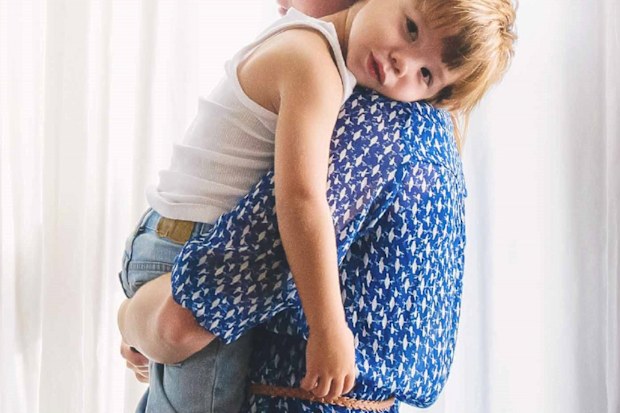 Mother holding toddler son
