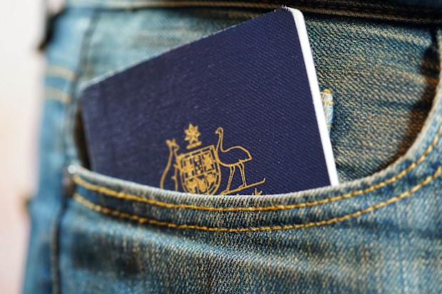 Australian passport in jeans pocket, close up.