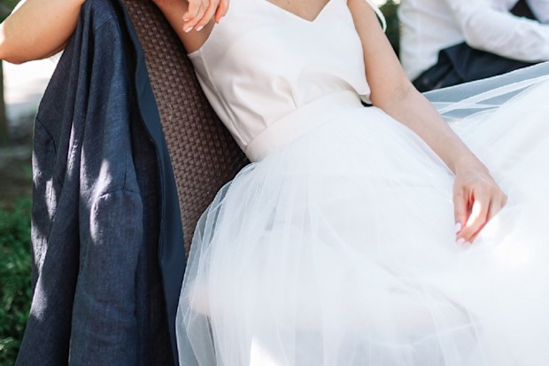 Bride sitting angry at wedding