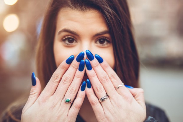 Woman with long painted nails.
