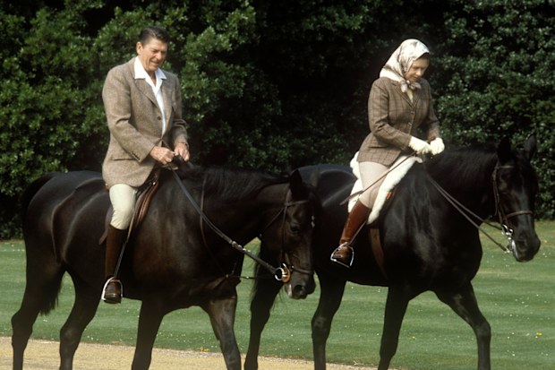 Queen Elizabeth II, Ronald Reagan, President of the USA, Queen Elizabeth II riding in the grounds of Windsor Castle with US President Ronald Reagan, during his state visit to the UK, 8th June 1982. She is riding her horse ëBurmeseí and he is mounted on 'Centennial', both gifts to the Queen from the Canadian Mounted Police, 8th June 1982. (Photo by John Shelley Collection/Avalon/Getty Images)