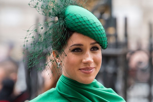 Meghan Markle dressed in green smiling