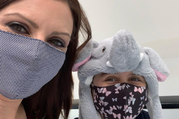 Jo Abi and her daughter wearing masks.