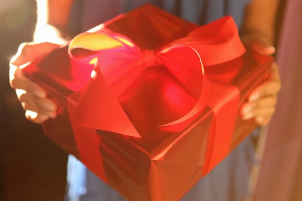 Wife giving husband gift for Valentine's Day