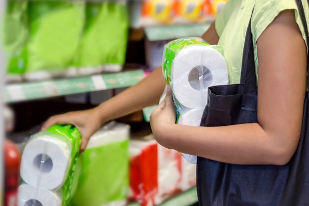 Woman with bags paper towels