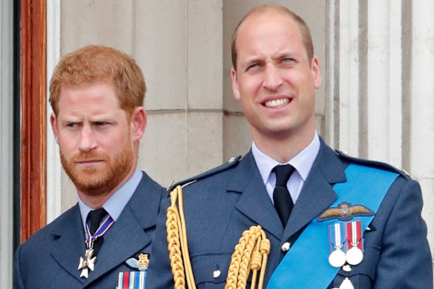 Meghan, Duchess of Sussex, Prince Harry, Duke of Sussex, Prince William, Duke of Cambridge and Catherine, Duchess of Cambridge watch a flypast to mark the centenary of the Royal Air Force from the balcony of Buckingham Palace on July 10, 2018 in London, England.