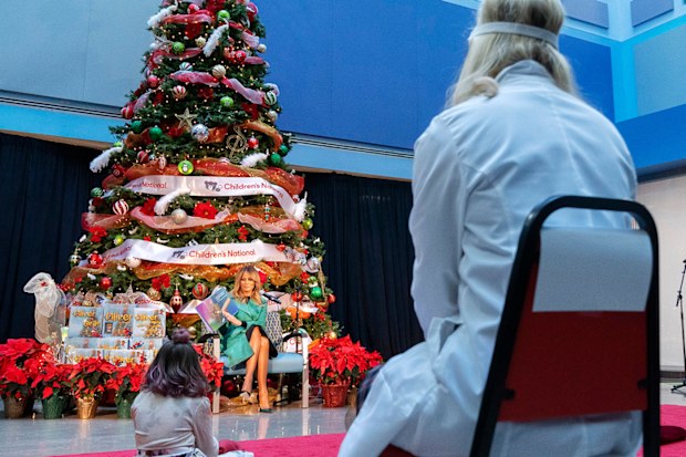 First lady Melania Trump reads a Christmas book to children who are patients at Children's National Hospital.