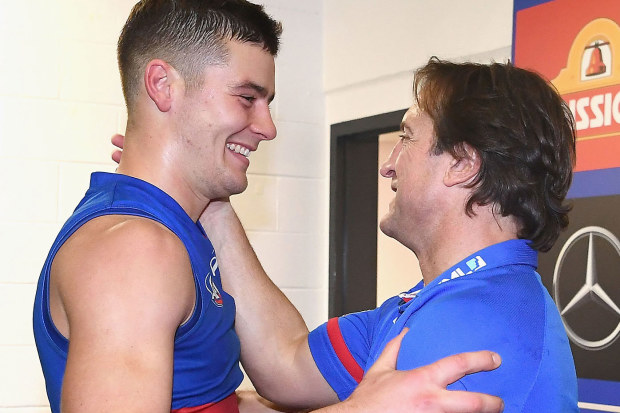 Josh Dunkley and Luke Beveridge pictured together in happier times before Dunkley's departure from the Bulldogs