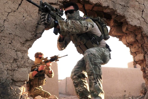 Special Operations Task Group  members entering the training compound at Multi National Base Tarin Kowt.