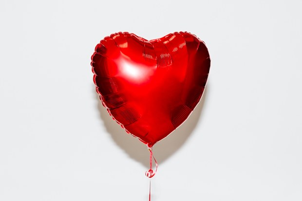 Red heart shaped helium balloon
