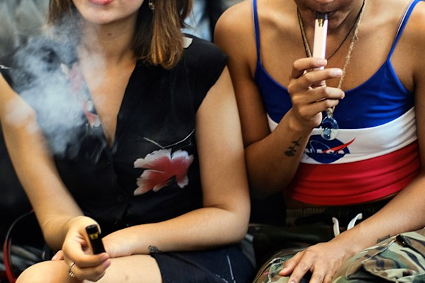 Two women vape at a party in Los Angeles. Last week, the Centers for Disease Control and Prevention in the US said more than three-quarters of the 805 confirmed and probable illnesses from vaping involved THC, the ingredient that produces a high in marijuana. 