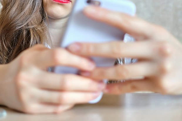 Woman texting on phone
