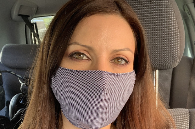 Jo Abi wearing a fabric face mask in public.