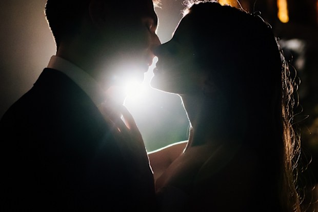 Man and woman on date kissing
